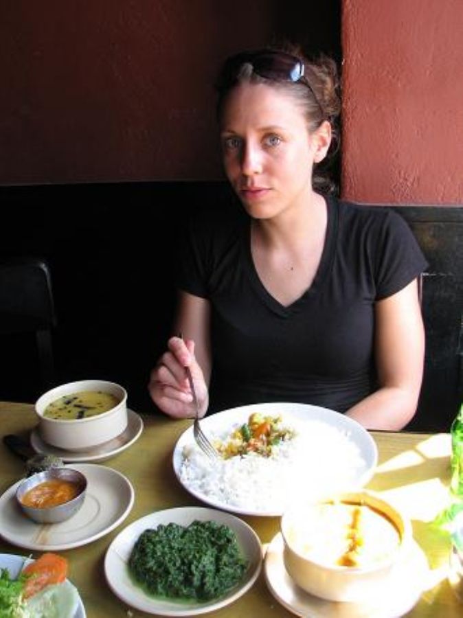 Neta eating Traditional Dal Baht